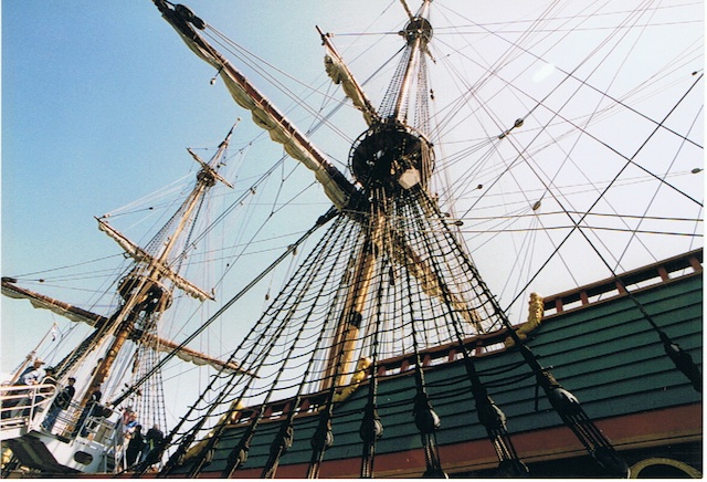 View of a mast showing the rat lines and rigging including yardarms