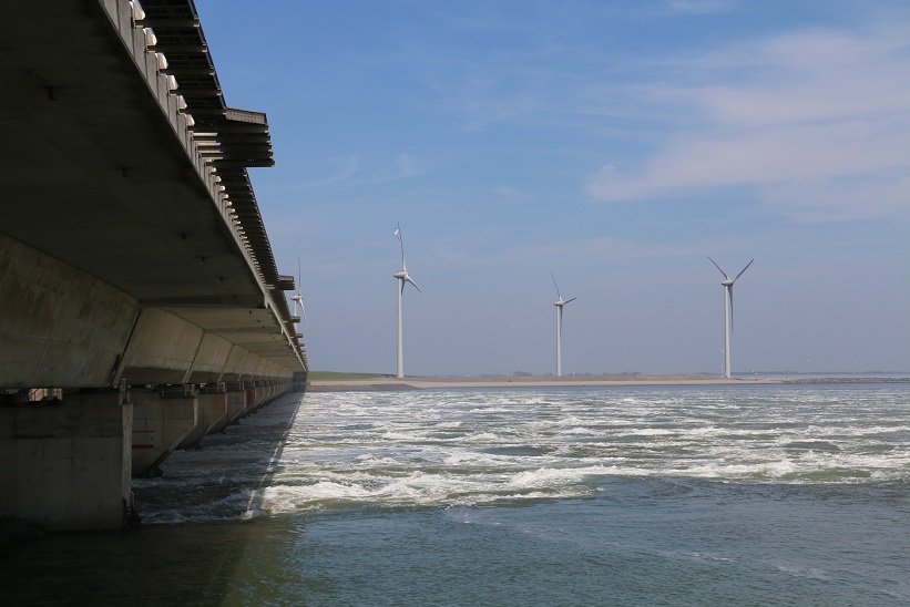 IMG 2991 The storm surge barrier, gates up, with the tide rushing in from the North Sea. And (of course) a wind farm.