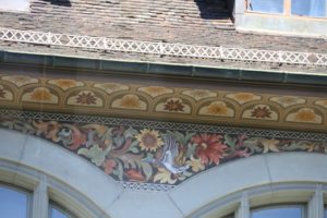 Detail of paintwork above the window arches in the museum