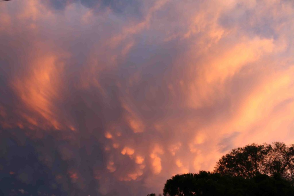 A gathering storm at sunset