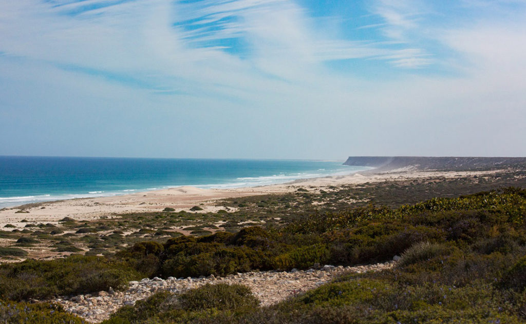 There are beaches in places before the cliffs return