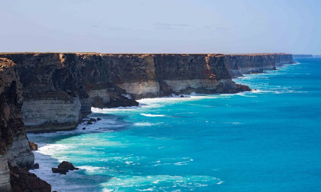 Waves crash on the rocks of The cliffs of the Bight