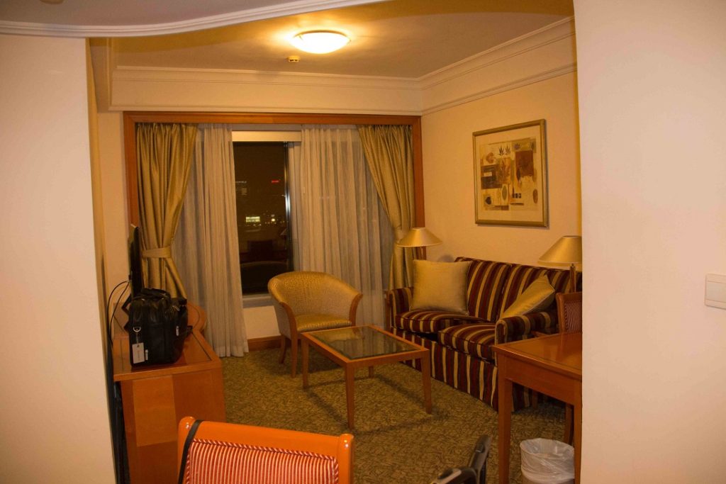 The sitting room. A dining chair is in the foreground.