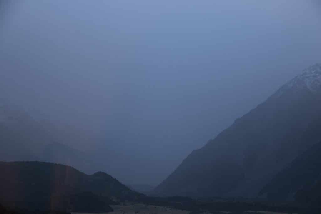 Mist fills the valley. Aoraki is shrouded