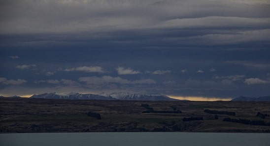A fringe of dawn under the cloud covering the Alps