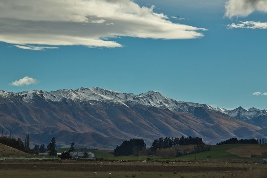 Snoww caps the lower mountains with grazing land on the flats