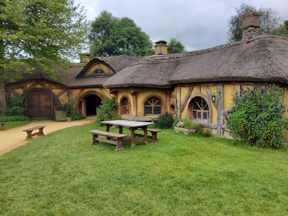 Hobbiton the Green Dragon pub, thatched roofs and ochre daub exterior
