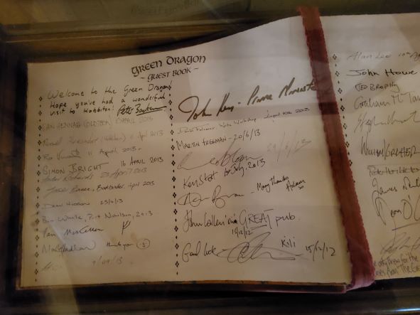 Hobbiton guest book with signatures of famous people who have visted.