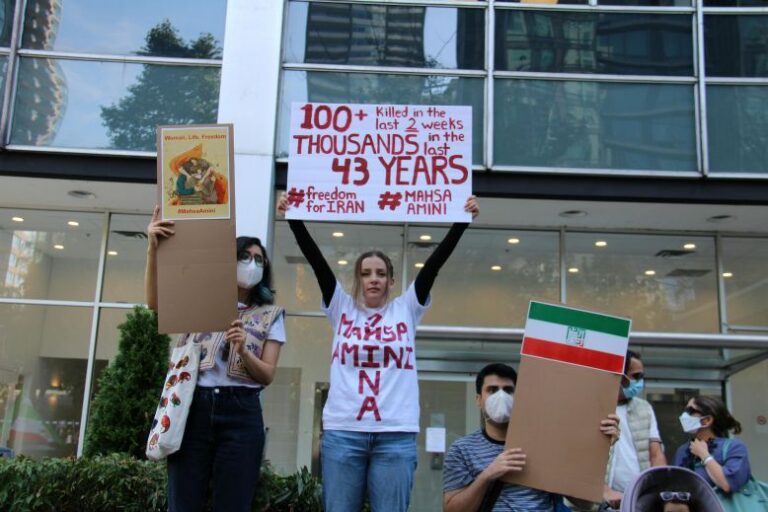 Iran protests. Western protestors hold signs demanding freedom for Iran