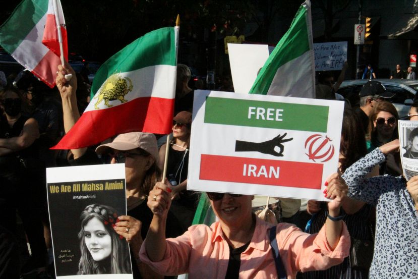 Iran protests shw poster of Mahsa Amini and 'free Iran'