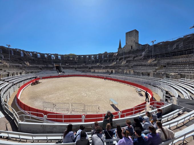 Arles amphitheatre, a circular arena surrounded by rows of stone seats set in tiers