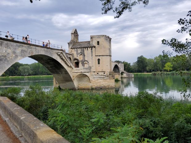 Avignon bridge taken from the shore showing one parapet in the river