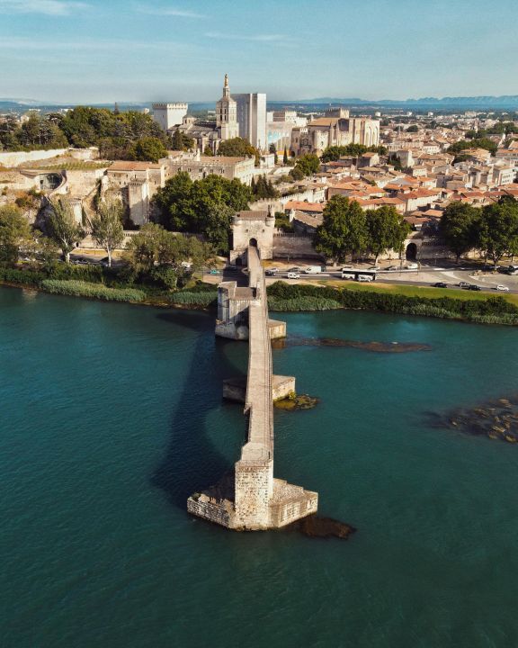Arial photo of Avignon showing the famous bridge pointing to the papal palace