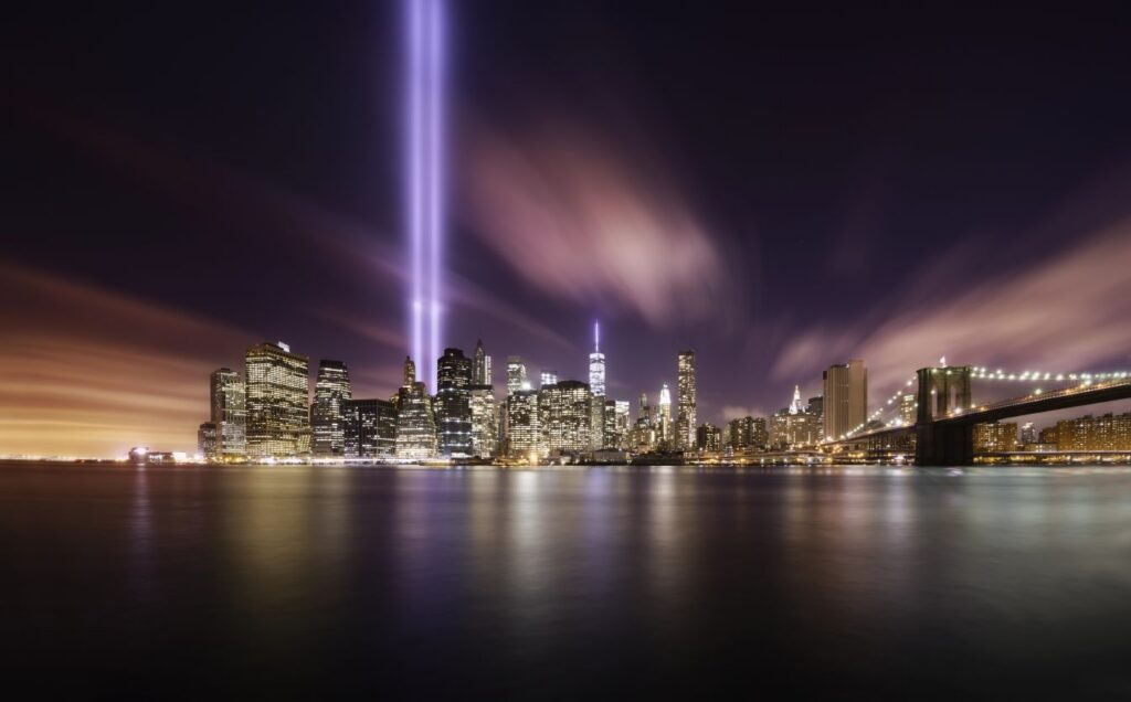 Twin towers tribute 2 bright blue lights shine up from where the twin towers used to stand in Manhattan. 
